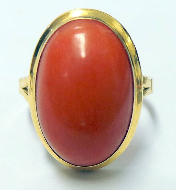 18K Ring with Solitaire Cabochon Coral: Yellow gold, cabochon coral measures 17 x 12 mm, ring size 8, 3.9 dwt