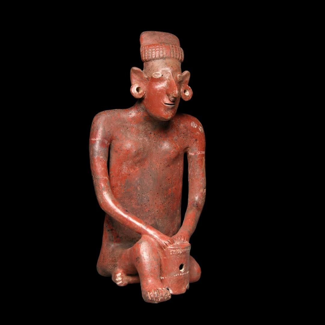 Monumental Pre-Columbian Sheepface drummer figure: Pre-Columbian Jalisco "Sheepface" drummer figure froom West Mexico, ca. 100 BCE-250 CE., Tala Tonala type, crafted in a reddish-brown terracotta typical of the Jalisco style from ancient West Mexico. 