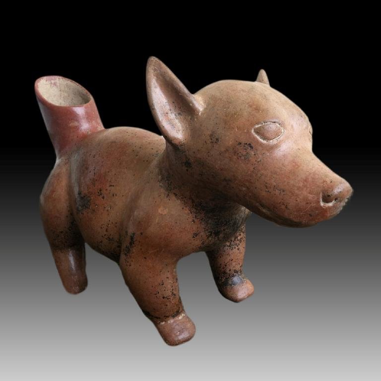 Large Pre-columbian Colima Dog Vessel: Pre-columbian Colima Dog from West Mexico, ca. 100 B.C.-250 A.D. Portrayed in a standing position with stocky body, perked ears, incised eyes and a spout at the back. A very superb and large example i