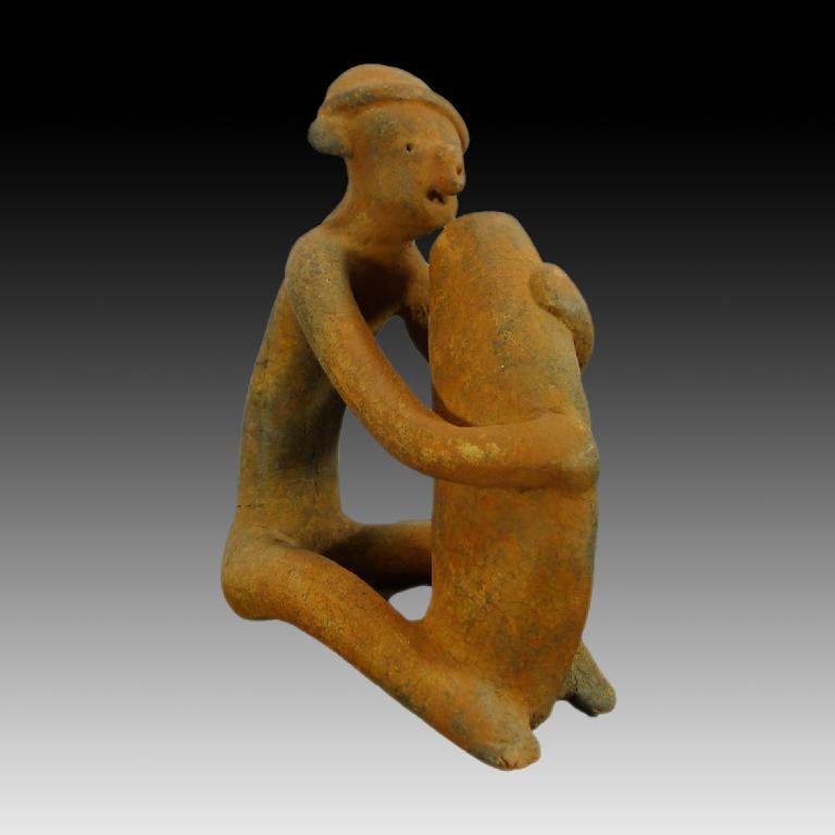 Pre-columbian Chinesco figure: Pre-columbian Chinesco figure from West Mexico, ca. 100 B.C.-250 A.D. In a seated position and beating on a gourd. Wearing a headband and nose ring. Similar style in Hasso Von Winning - The Shaft Tomb