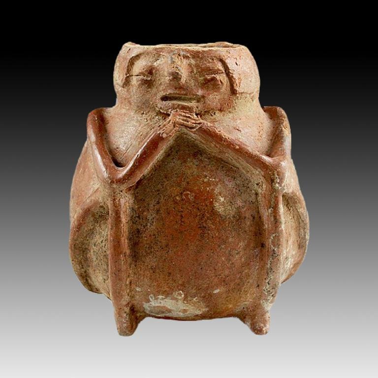 Rare Pre-columbian Narino Seated Figural Vessel: A Pre-Columbian vessel in the shape of a seated figure of a type known from the Capuli Cultural Complex of the ancient Narino region of Colombia, circa 850 - 1500 A.D. These figures are quite rare and