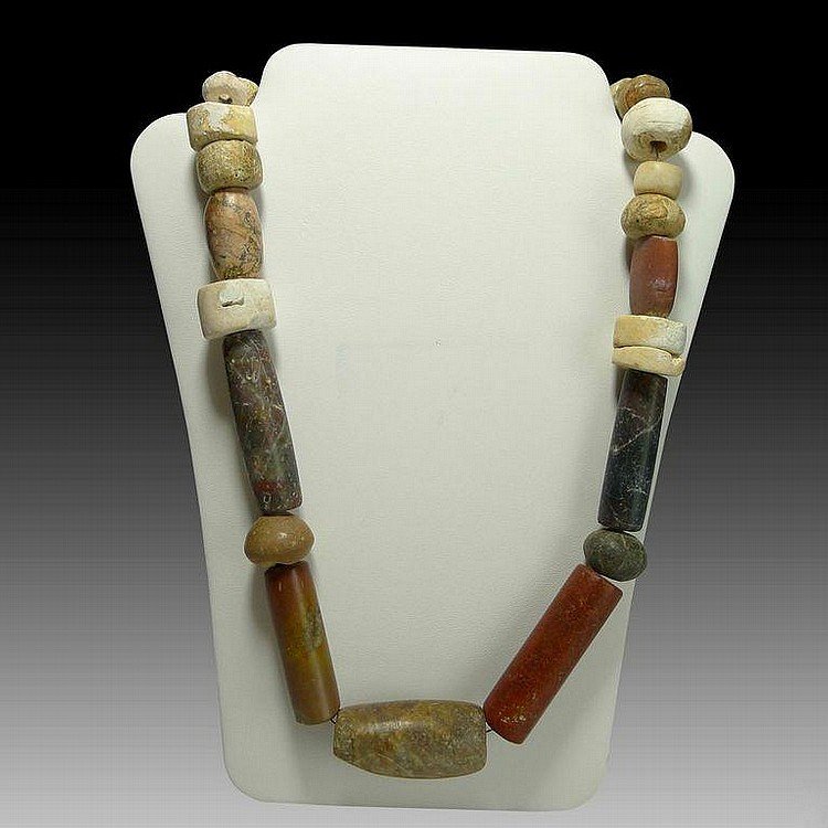 Pre-columbian Tairona Necklace: Pre-columbian Tairona Necklacefrom Colombia, ca. 500-1000 A.D. Composed of a single strand of various shape and size jasper, stone, shell and clay beads. Small modern clasp. 21"L x .5"D All lots will 