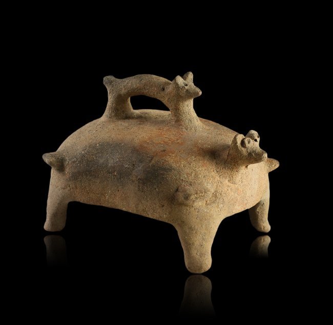 Large Pre-Columbian Colima Dog Form Incense Cover: A large and interesting incense cover from ancient Colima, West Mexico, circa 200 B.C. – 200 A.D. The form is wonderful, depicting the incense cover as the body of a dog, featuring a handle in the f