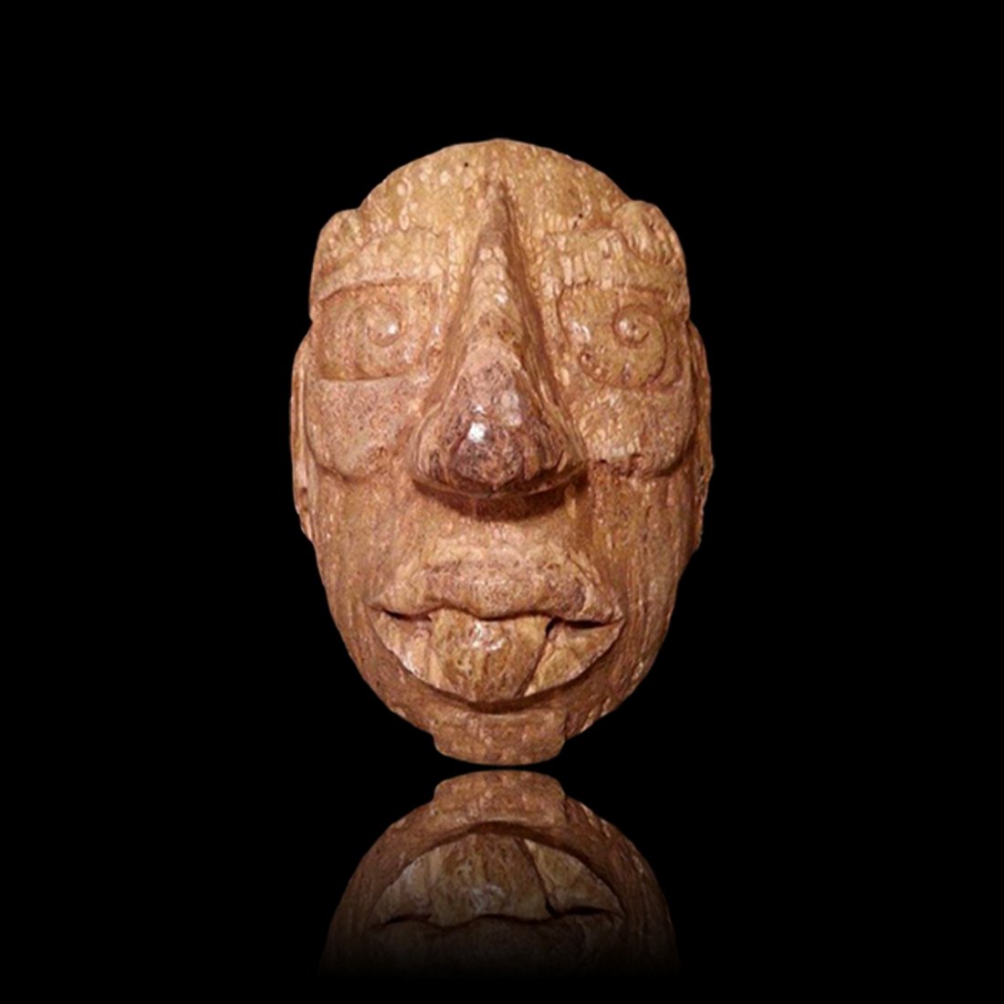 Important Maya Fossilized Tusk god G Mask: Important Maya Fossilized Tusk god G Mask from Campeche - Mexico, ca. 600-900 A.D. Carved from a large piece of fossilized Mammoth Tusk in the form of the god G. K'inich Ahau was the sun god also know