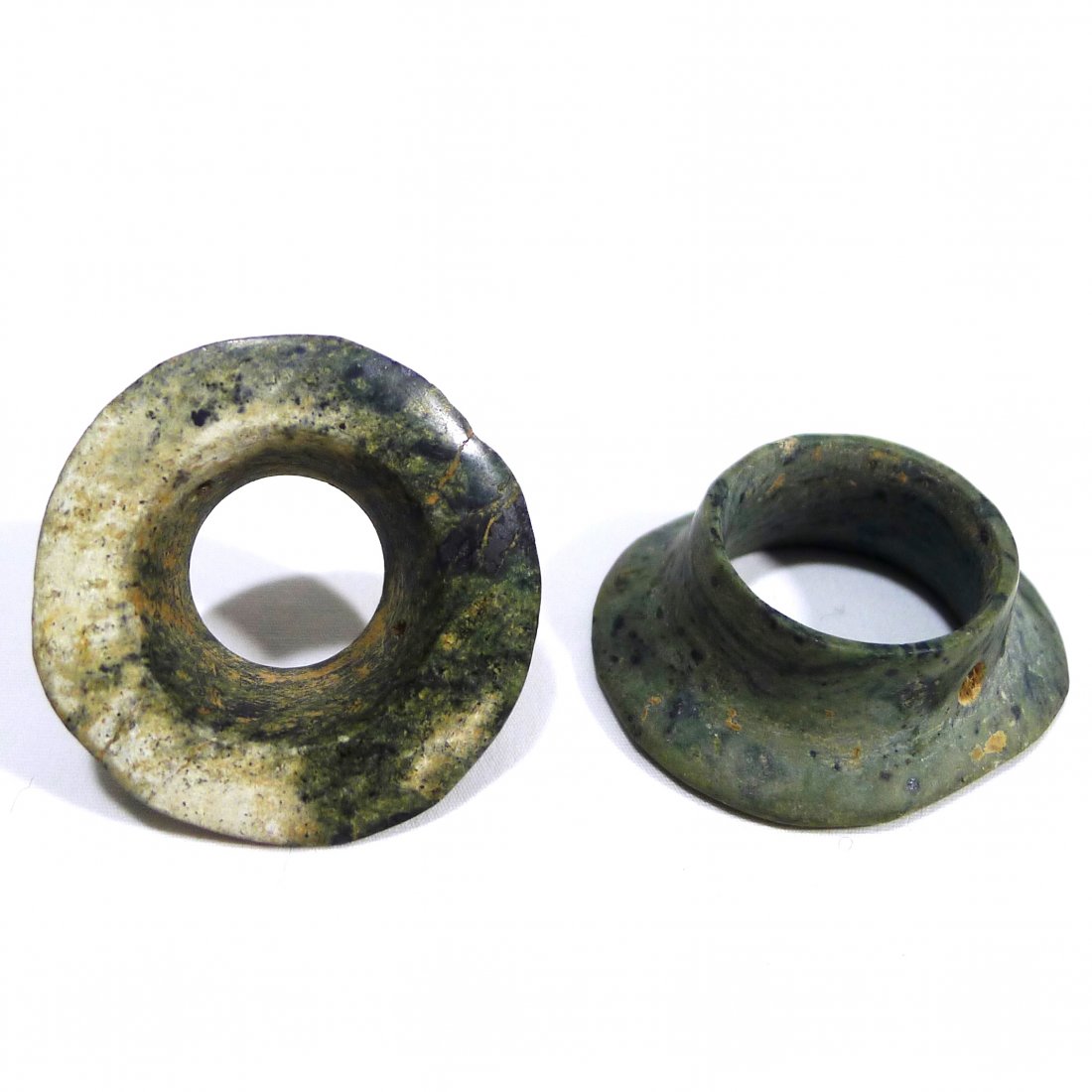 Pre-columbian Mezcala Earspools: Pre-columbian Mezcala Earspools from West Mexico, ca. 400 B.C. Both carved from a speckled green stone. All lots will be sold with a COA guaranteeing the authenticity of the piece for a lifetime. Al