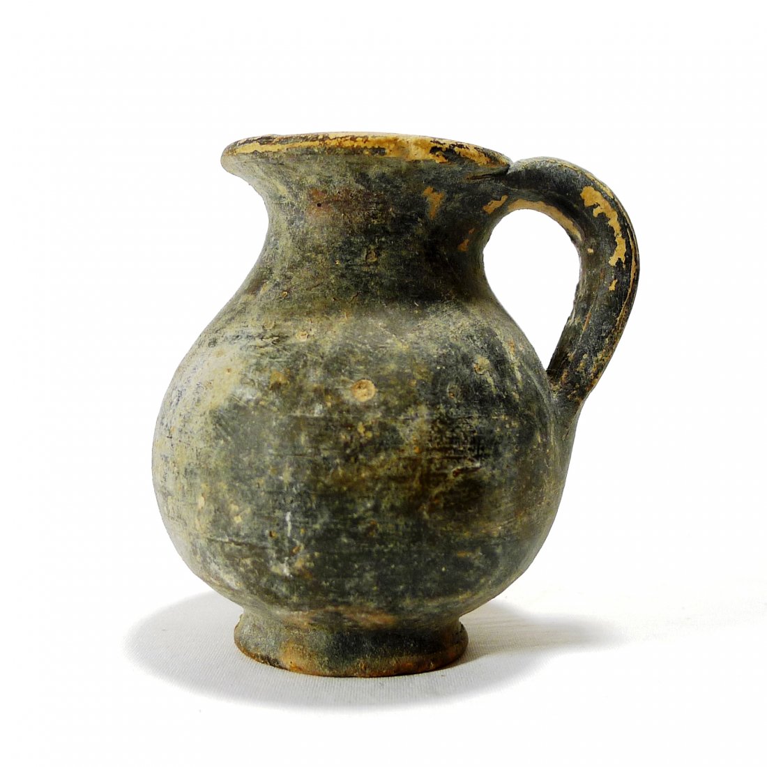 Ancient Greek Cup: Ancient Greek Cup, ca.3rd Century B.C. In the shape of a small mug with handle which would have been used for wine. Nice! All lots will be sold with a COA guaranteeing the authenticity of the piece fo