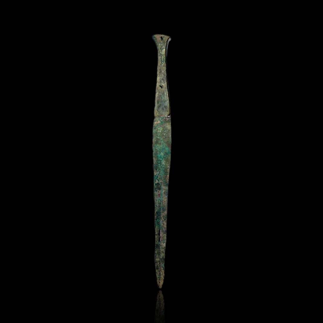 Ancient Luristan Bronze Dagger: A heavy bronze dagger or short sword, Luristan, c. 1200 – 1000 BC. This finely made weapon is cast in one piece. The tapered blade has a thick center rib and the hilt is flanged for inlays, retainin