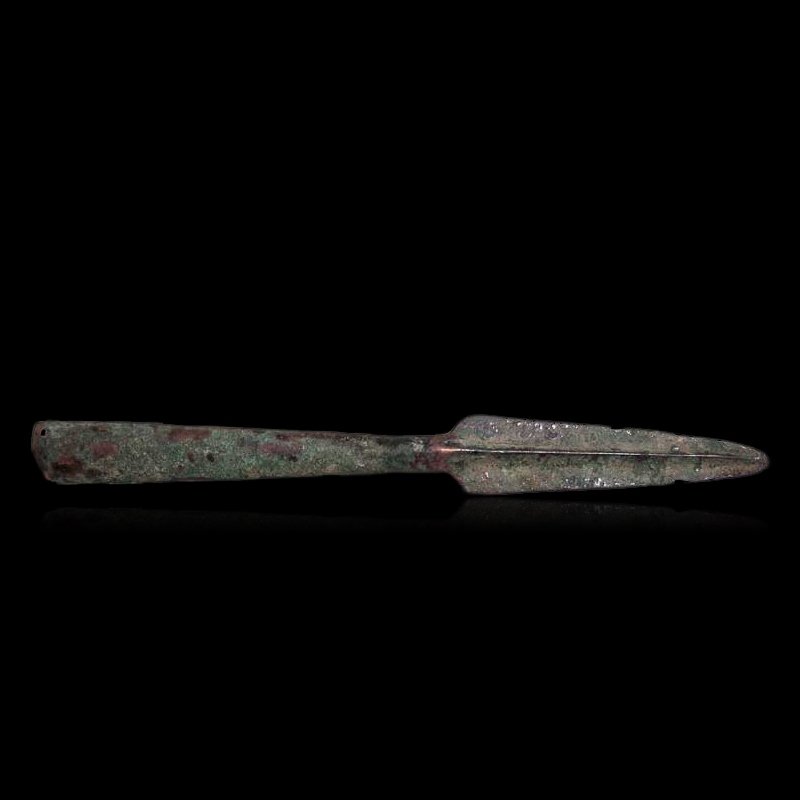 Ancient Roman Lance: An excellent Roman lance, ca. 2nd – 4th Century AD. This socketed bronze weapon retains a sharp edges and point and has good mineral deposits All lots will be sold with a COA guaranteeing the authen
