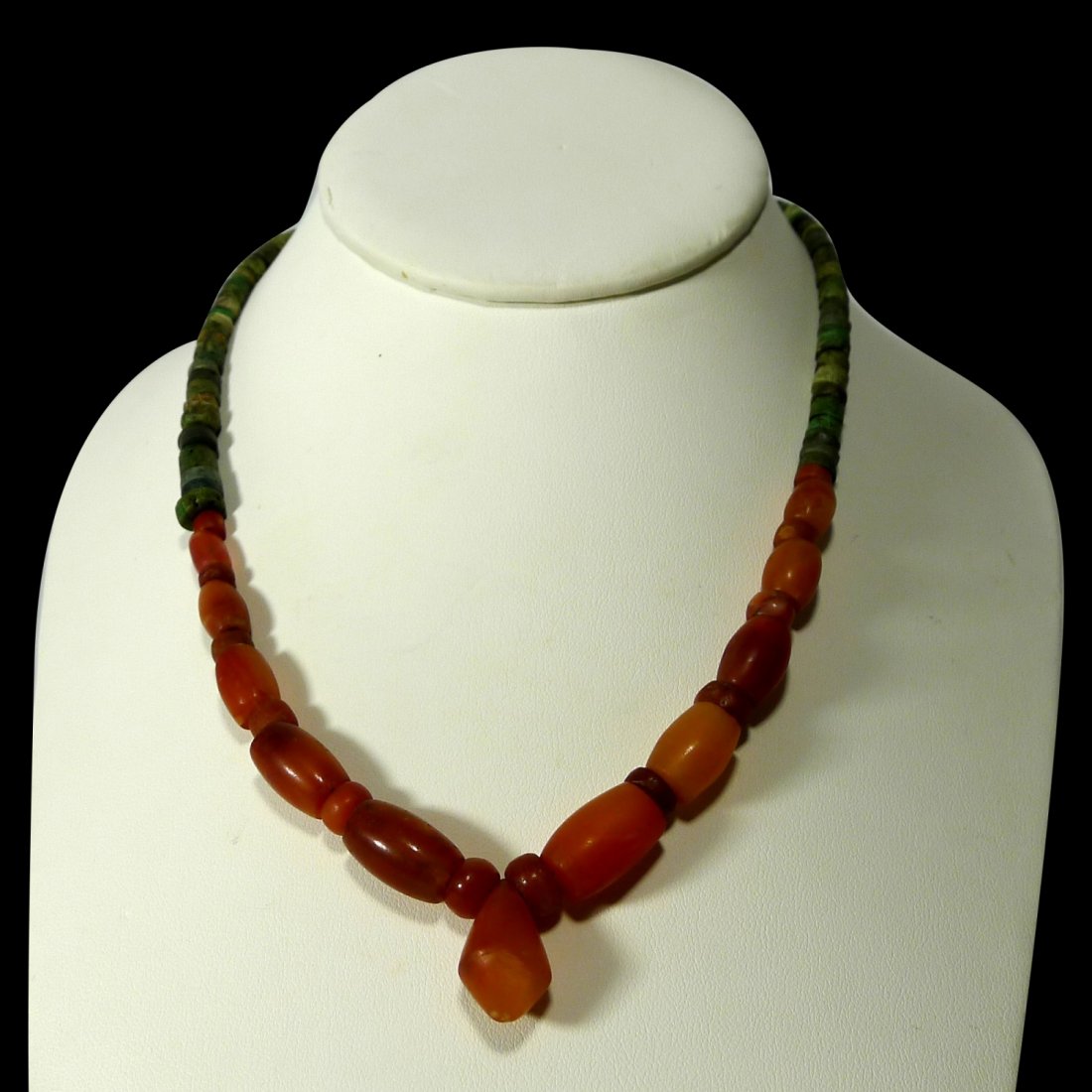 Pre-columbian Tairona Necklace: Pre-columbian Tairona Necklace from Colombia, ca. 1000-1500 A.D. Composed of several green stone and carnelian beads with a central pendant.