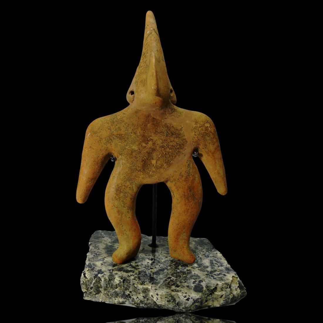 Pre-columbian Colima Gingerbread Figure: Colima Figure from West Mexico, ca. A "gingerbread" type figure with cone head and arm to it's side. Custom Granite stand included. All lots will be sold with a COA guaranteeing the authenticity of th