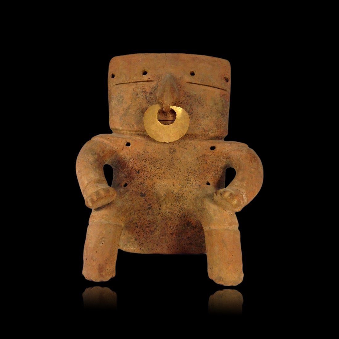 Pre-columbian Quimbaya Retablo Figure w/ gold nose-ring: Excellent Quimbaya Retablo “Biscuit” hollow pottery male figure from Colombia, ca. 500 A.D. Slightly rounded slab-type body and large rectangular head, both hands resting on knees. Gold nose ring 