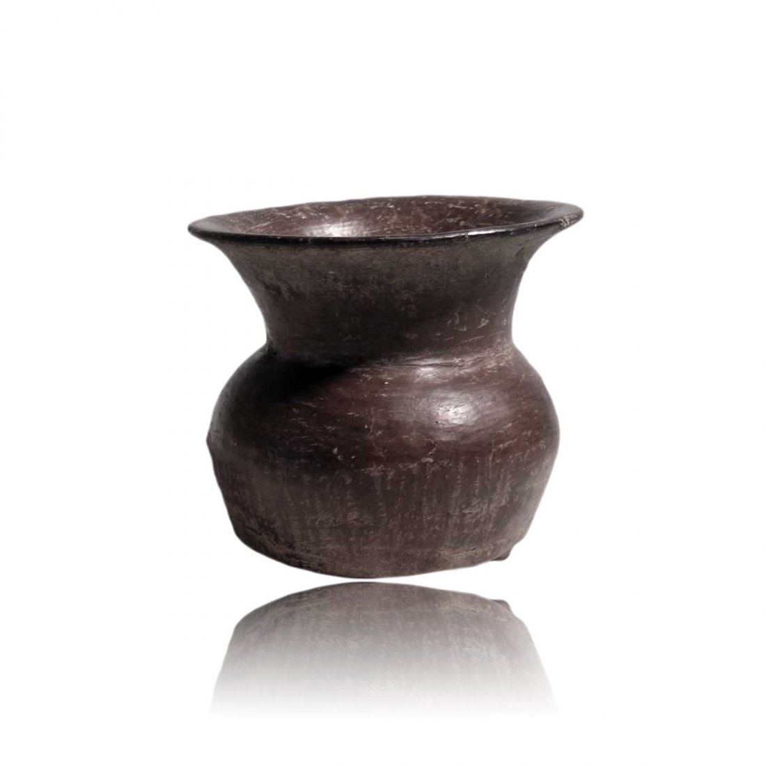Pre-columbian Teotihuacan Tripod Jar: A large Teotihuacan tripod jar from Mexico, ca. 300 – 400 AD. This Late Tlamimilolpa type is 4” high, 4-1/2” in diameter and stands on the characteristic trio of nubbin feet. The corseted rim is
