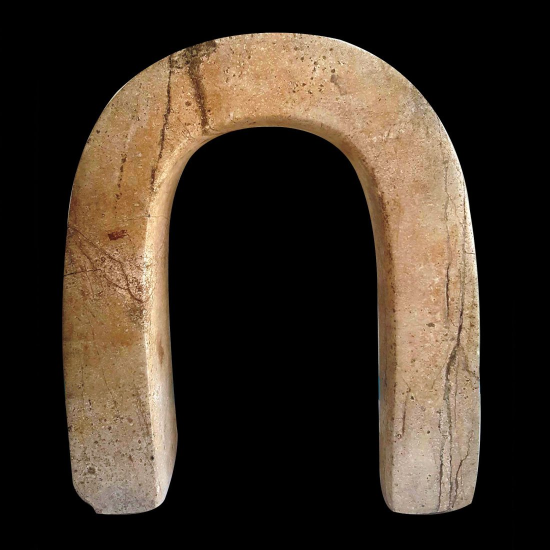 Pre-columbian Veracruz Serpentine Yugo: Pre-columbian Veracruz Serpentine Yugo from Mexico, ca. 600-900 A.D. Light cream colored serpentine stone in the shape of a ball game yugo. 15.55″ in length x 13.38″ in width x 4.13″