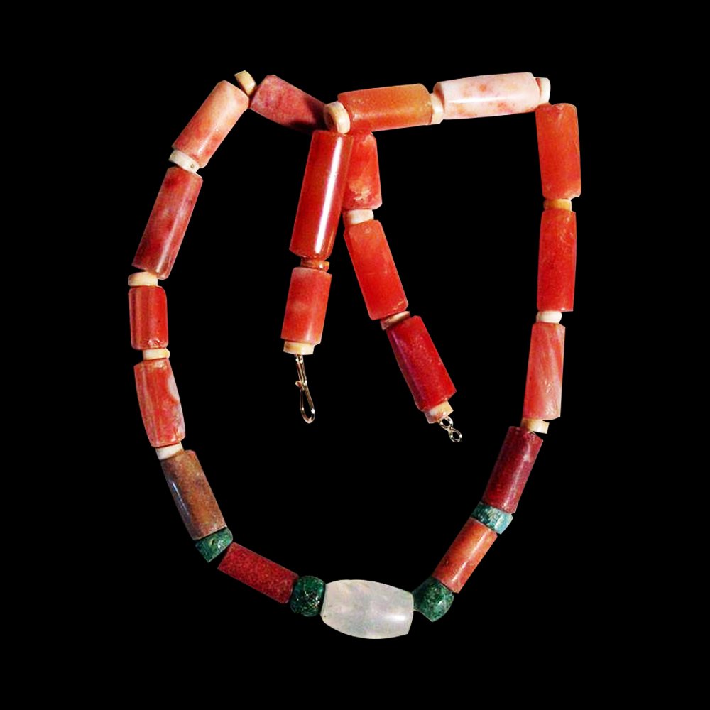 Pre-columbian Tairona Necklace: An excellent Tairona necklace from Colombia, ca. 1000 – 1500 AD. This beautiful piece of jewelry is 24-1/2" long and is made from large carnelian and crystal tubes. All are highly polished and surro