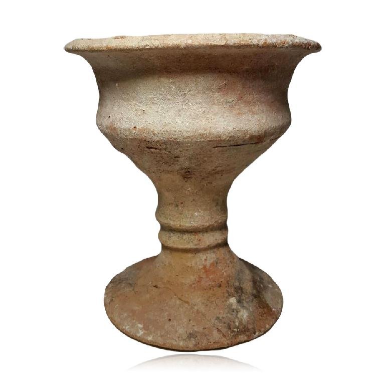 Important Ancient Judean Pottery Chalice: Judea, Iron Age II, ca. 7th-8th Century B.C. an important “chalice” vessel in orangeware. Deep bowl with angled belly and turned out rim; all on tall ribbed foot. Rare7.25″ in height.