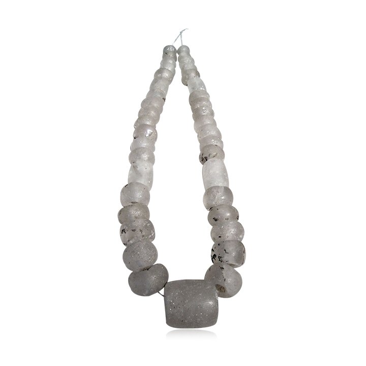 Pre-columbian Sinu Crystal Necklace: A magnificent Sinu necklace from Colombia, ca. AD 1000 – 1500. The strand is 31” long and is comprised entirely of crystal beads, including an enormous 1-1/2” long barrel used as a pendant. Rare