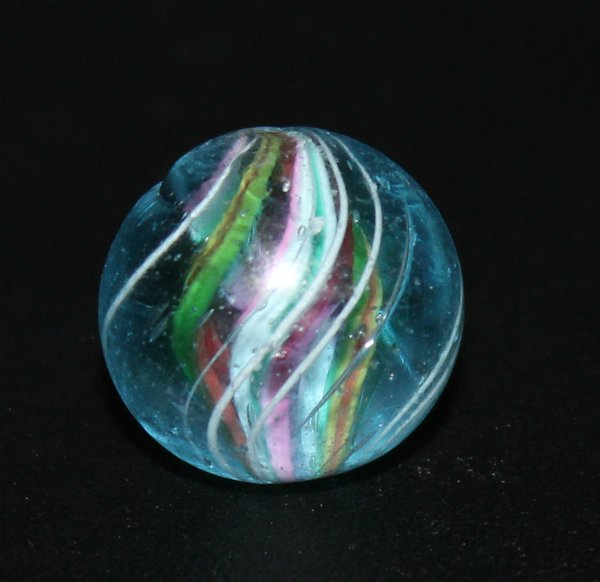 Handmade German Swirl Marble Aqua Tinted Divided Core: Old German handmade swirl marble measuring .70". The glass on this marble is aqua in color (not lavender or purple which is caused from exposure to sunlight). This makes the marble quite rare. Overall