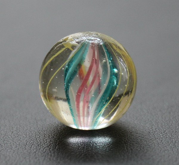 Old Divided Core German Swirl Marble Handmade: Beautiful antique German handmade marble with divided core. Measuring .66" with two pontils, one is faceted. Marble looks great in hand, no damage visible to the naked eye.
