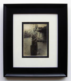 Tribal Woman Liberia photo 1906 framed: "Tribal Woman" Silver Gelatin Print, 1906 Monrovia/Liberia. C. 4 7/8 x 6 3/4 inches. This work is double matted and framed in a solid wood moulding. The frame is new. Dimensions: c. 13 x 15. This artw