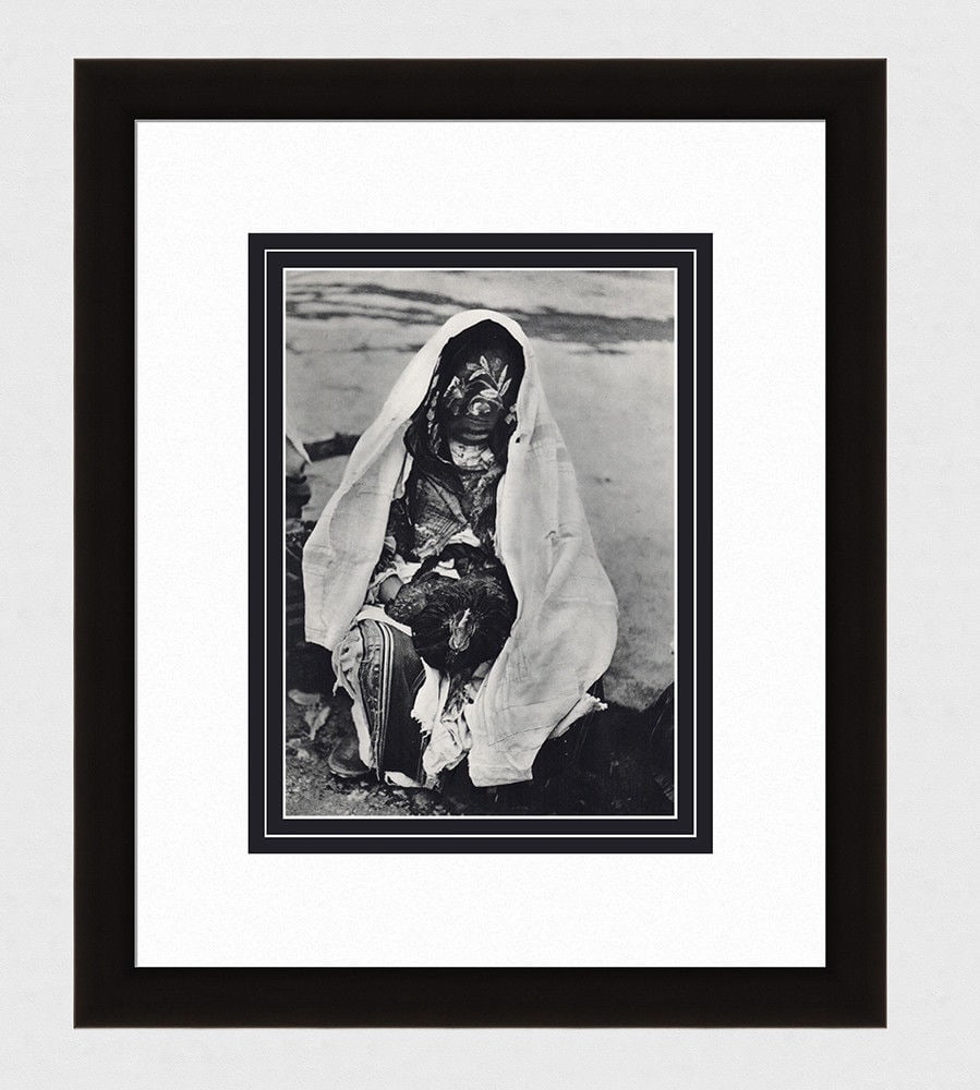 Andre Zucca Portrait of a man wearing an Akhnif 1930's photogravure: Andre Zucca (French, 1897 -1973). Portrait of a man wearing an Akhnif. Antique Photogravure. 1937-1940. Excellent. Teriade. Draeger Freres. Image size 7 5/8 x 10 7/8 inches. Approximately 17 x 20 inch
