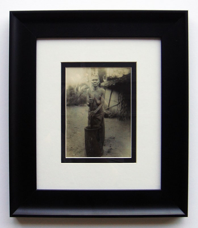 Tribal Woman Liberia photo 1906 framed: "Tribal Woman" Silver Gelatin Print, 1906 Monrovia/Liberia. C. 4 7/8 x 6 3/4 inches. This work is double matted and framed in a solid wood moulding. The frame is new. Dimensions: c. 13 x 15. This artw