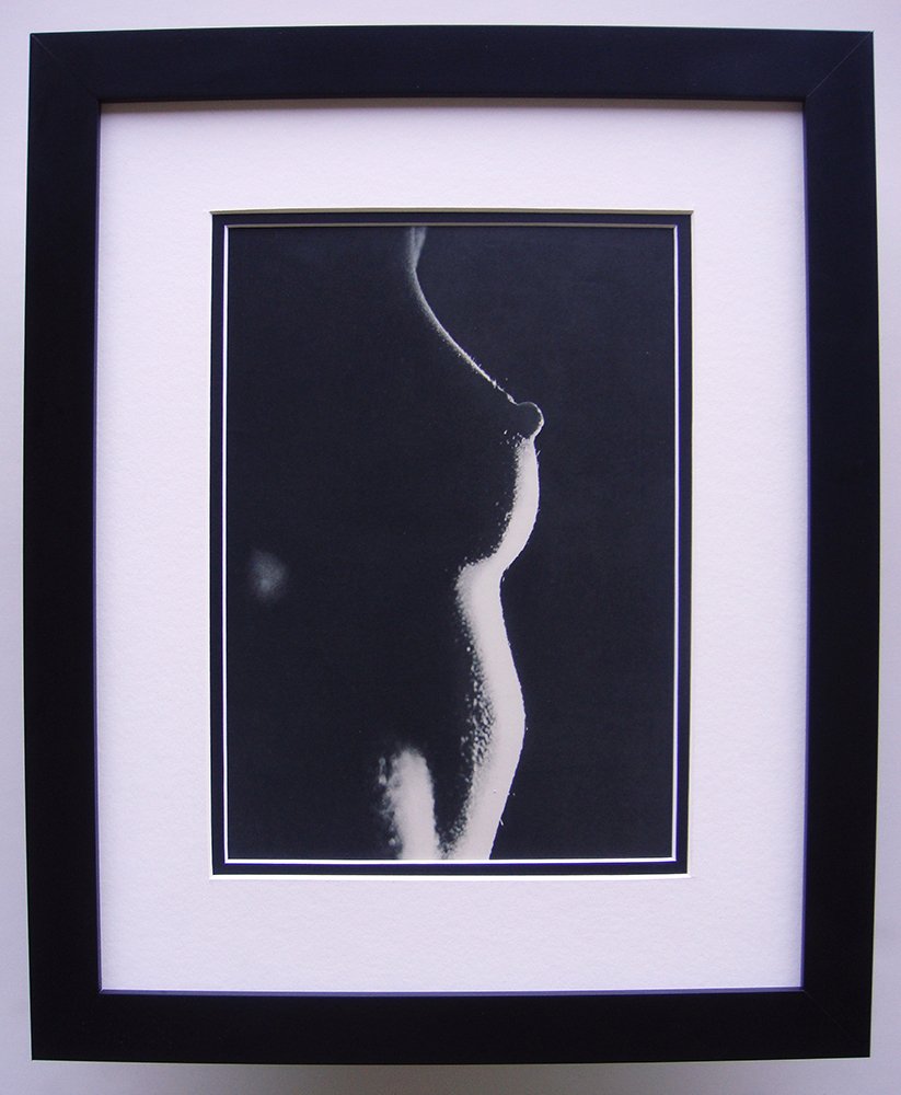 Erwin Blumenfeld Nude photogravure framed: Blumenfeld, Erwin (1897 - 1969). "Nude" Photogravure, 1937-1940. Double matted and framed in contemporary black frame. Framed dimensions 17 x 21 inches. Comes with a Certificate of Authenticity.