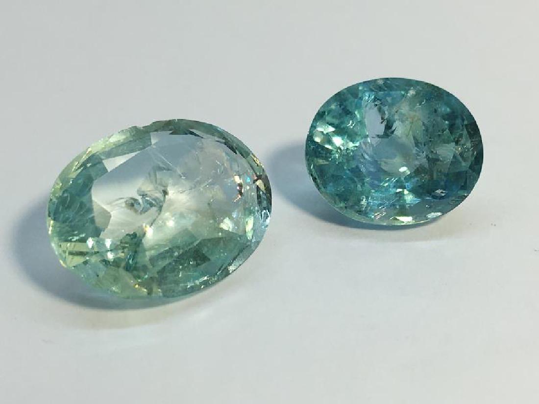 Two Oval facetted natural Aquamarines, weighing 7.25: Two Oval facetted natural Aquamarines, weighing 7.25 cts and 5.3 cts respectively. Of good blue colour, SI2 to SI3, the larger aqua has internal feathers.