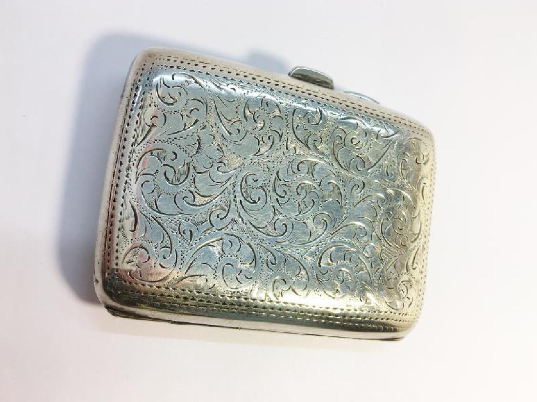 A Chased silver Ladies Cigarette Case, hallmarked (1 of 3)