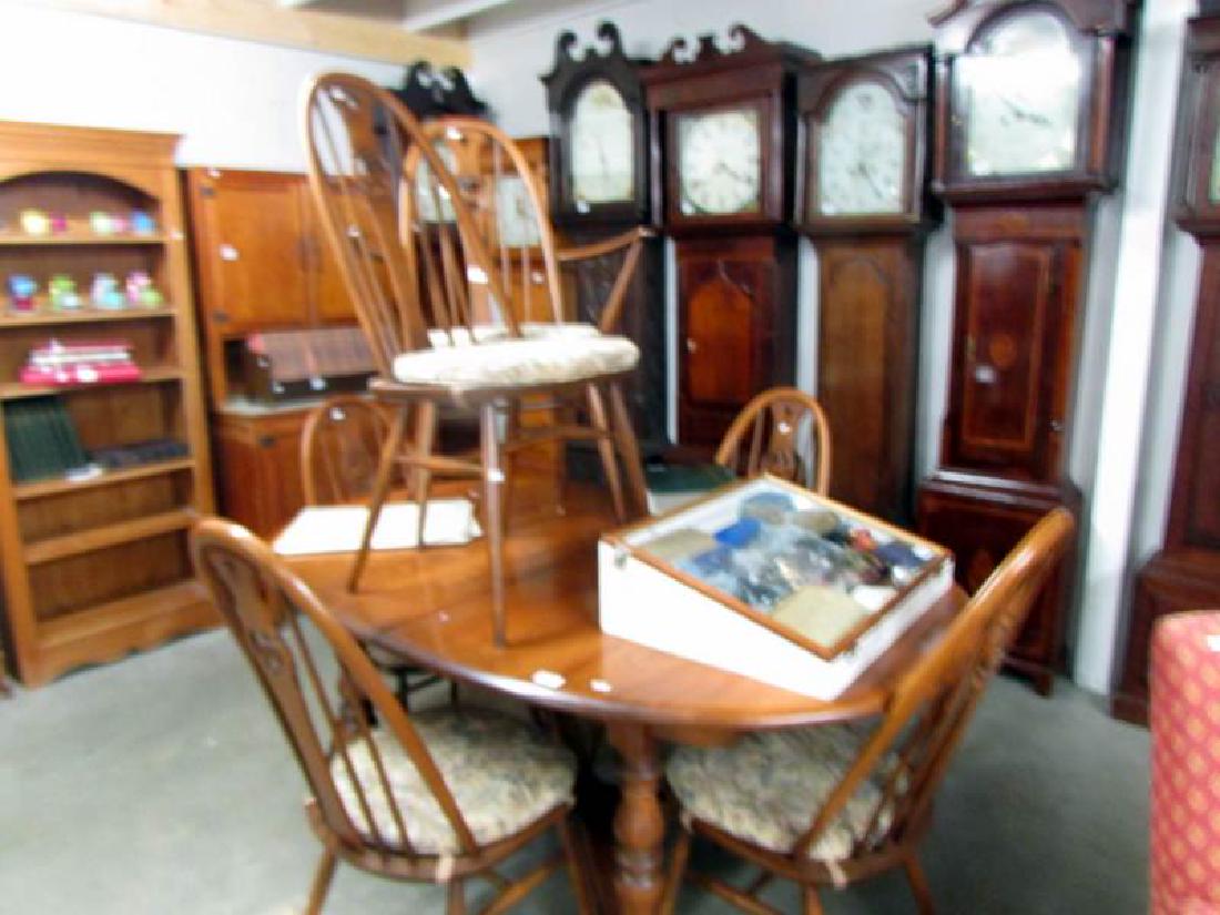 An Ercol dining table and 6 Ercol dining chairs.: An Ercol dining table and 6 Ercol dining chairs.