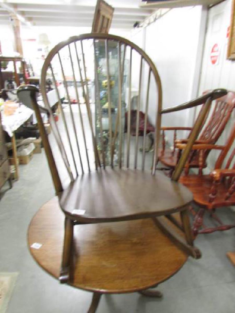 A dark Ercol rocking chair.: A dark Ercol rocking chair.