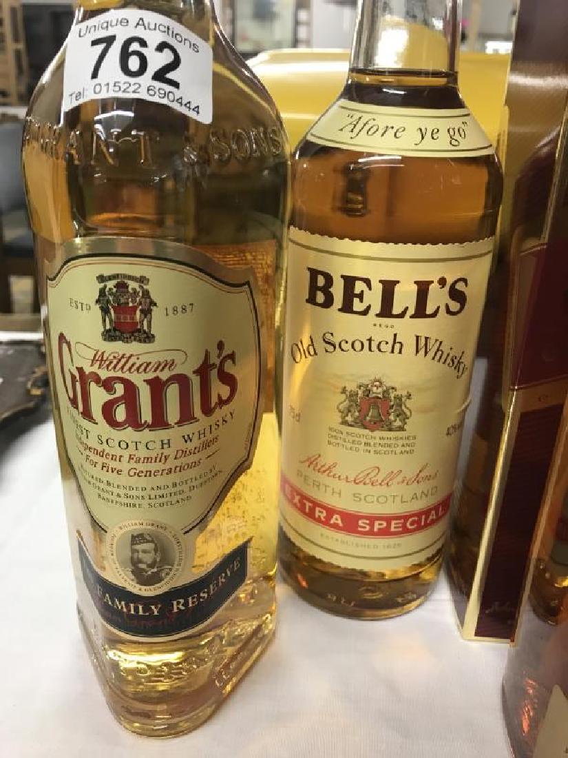 3 bottles of Scotch whisky including vintage Johnnie: 3 bottles of whisky including vintage Johnnie Walker, Grants and Bells.