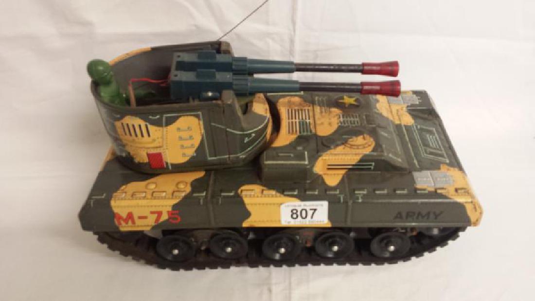 A Japanese battery operated toy tank with logo mark for: A Japanese battery operated toy tank with logo mark for YONEZAWA