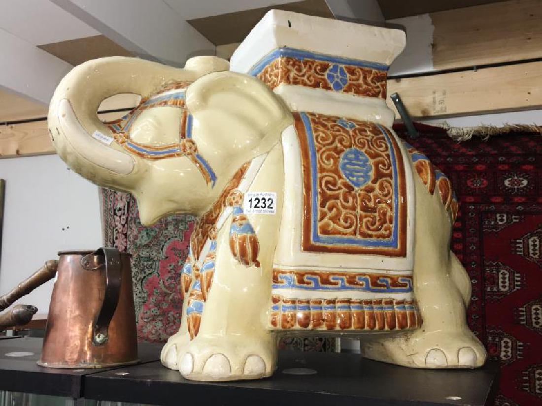 A pottery elephant seat.: A pottery elephant seat.