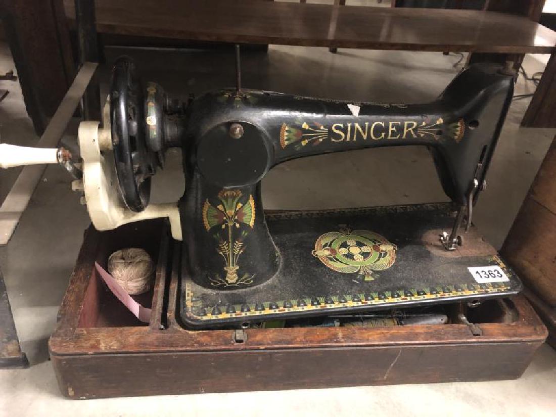 A Singer sewing machine.: A Singer sewing machine.