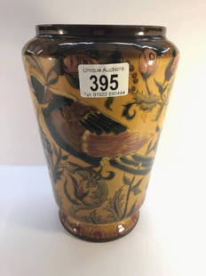 A Hungarian Zsolnay Pecs nicely decorated vase with: A Hungarian Zsolnay Pecs nicely decorated vase with hole manufactured in the base. Light brown ground with stylised plants and birds. Number on base 730.