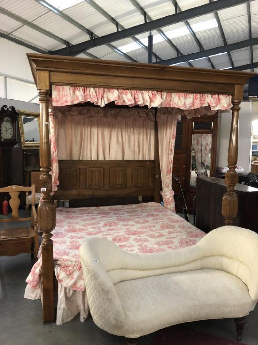 A superb quality four poster bed with carved post and: A superb quality four poster bed with carved post and linen carved headboard. Complete with drapes and cover.