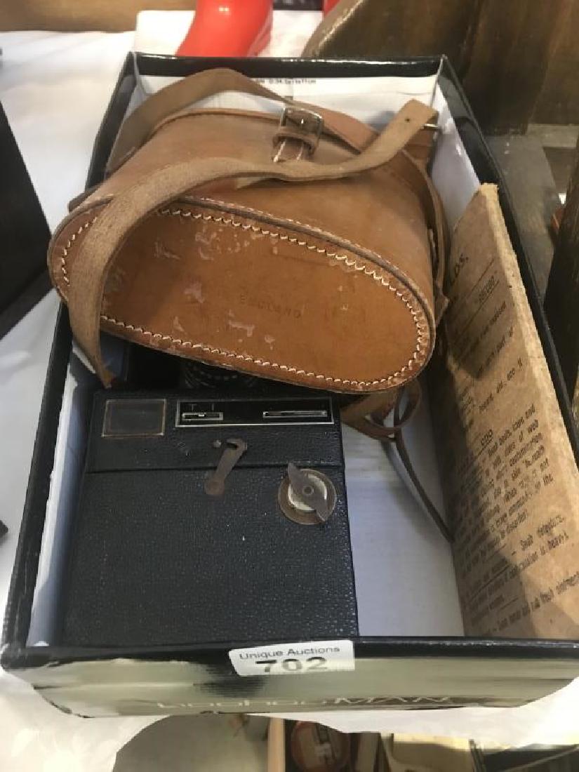 A spy camera a pair of binoculars brownie  anti gas