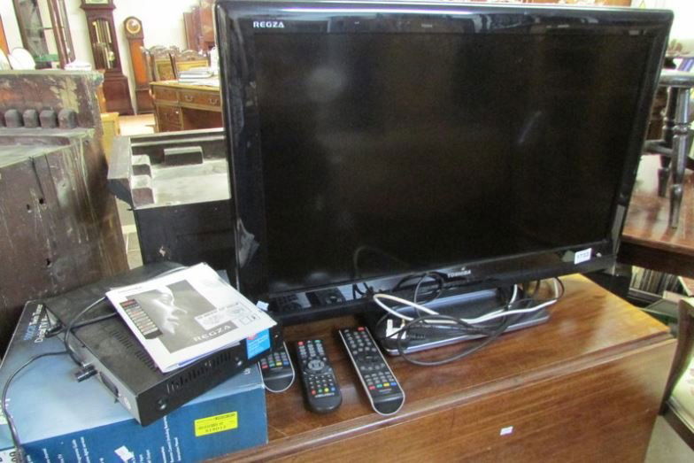A Toshiba flat screen TV and set top box: A Toshiba flat screen TV and set top box