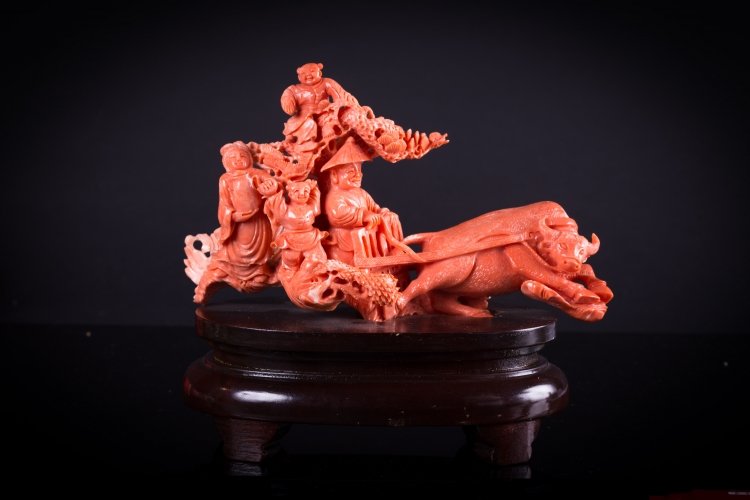 A large coral carving: China, early 20th Century Finely made large carving of figures in a cart driven by an ox. l 19 cm