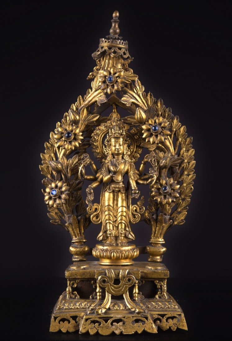 A bronze figure of Amoghapasa: Nepal, 19th Century A gilt bronze cast of Amoghapāśa. With eight arms and in a standing position, he is often mistaken for Avalokiteśvara, but he has a different role and function. He h