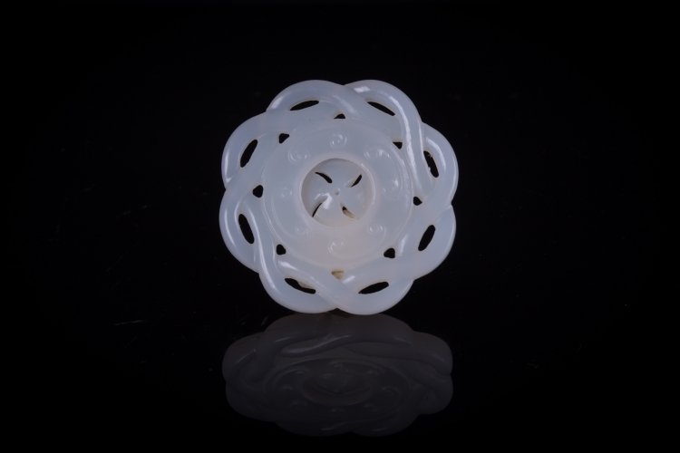 An opaline glass pendant: China, 20th Century A round glass pendant with revolving part in the middle. Diametro 5 cm