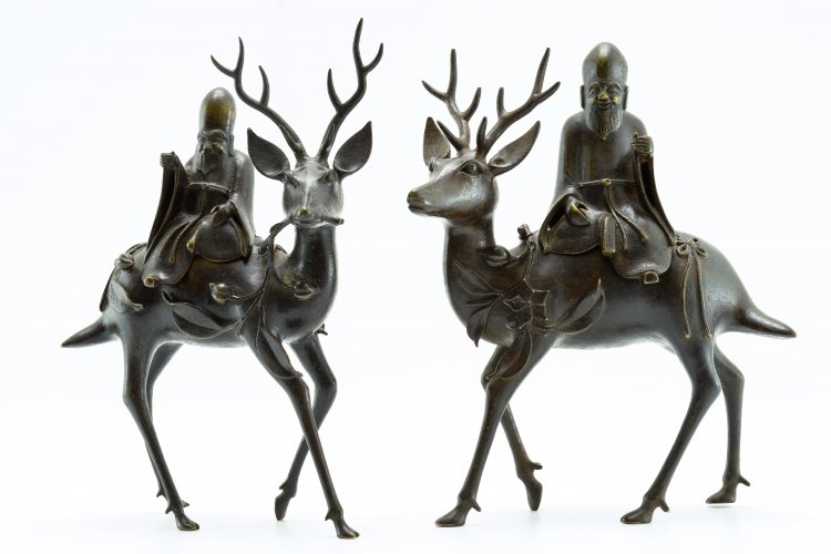 A couple of censers: China, Ming Dynasty, 16th Century Fine couple of bronze censers depicting Shulao on a deer. h 30 cm