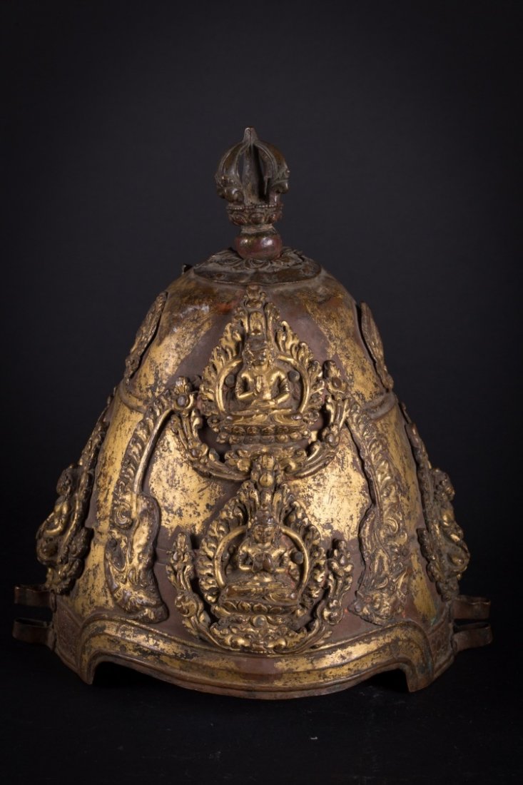 A ritual crown: Nepal, 16th-17th Century (?) A rare ritual crown also know as the Vajra crown, Vajracharya. It presents a copper body with traces of gilding and chasing, to which finly embossed decoration has been ap