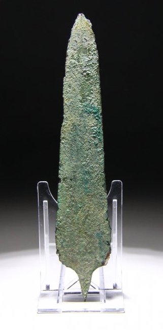 Near Eastern Pre Islamic Spearhead: Amlash culture, 1200-1100 BC. A bronze cast spearhead rounded shoulders and short tapering tang. Published 2006. Arms and Armors from Iran. The Bronze Age to the end of Qajar Period. Fig 286. Length: 
