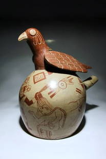 Pre Columbian Moche Fineline Vessel: Ancient Peru, 100-700 AD. A Moche painted in fineline technique stirrup vessel with weapons, finely dressed warriors and naked and tied captives. A molded bird at the top and depicted with arms and le