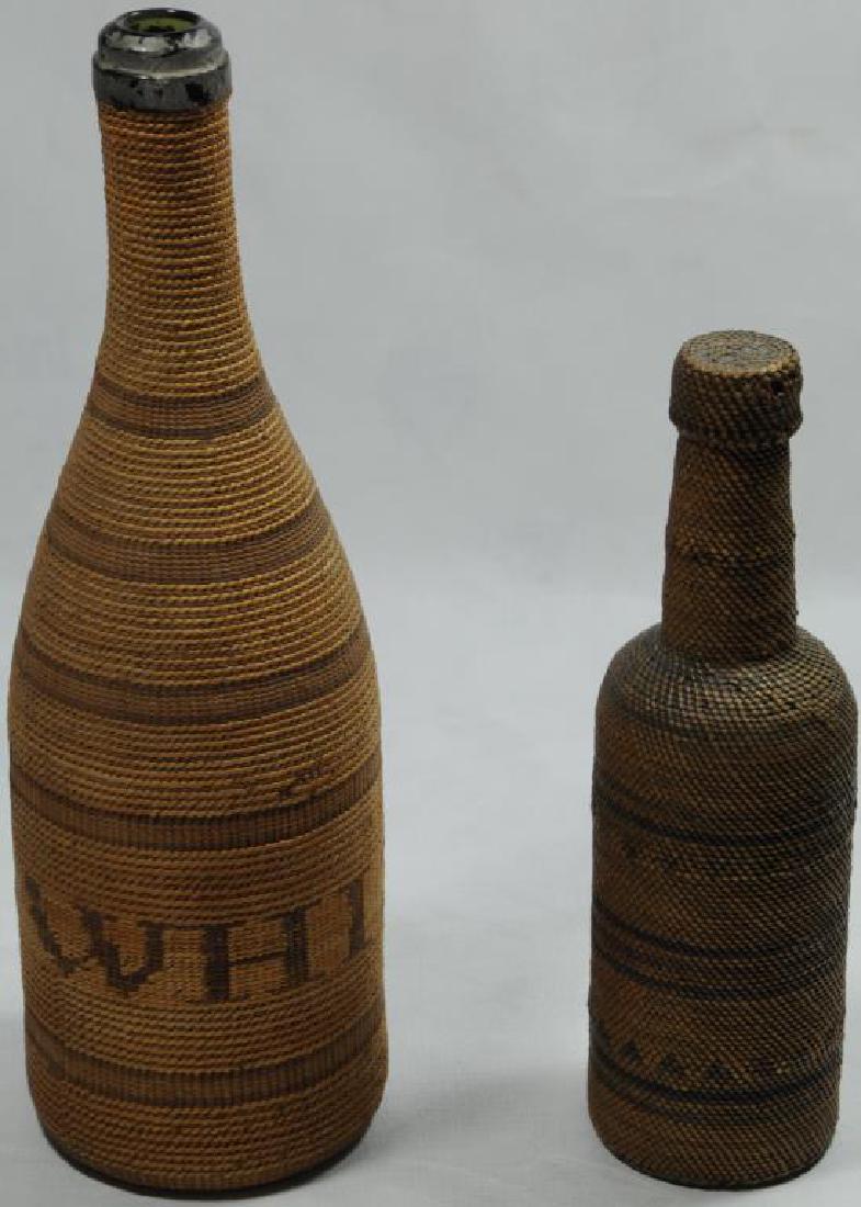 LOT OF 2 BASKETRY BOTTLES TO INCLUDE ONE EXTRA: FINE WOVEN NORTHWEST COAST BASKETRY BOTTLE WITH ORIGINAL TOP CAP. TIGHT WEAVE IN SHADES OF BROWN AND FADED PURPLE WITH VERY OLD GLASS BOTTLE INSIDE, 8 3/4" H, 1 1/4" TOP, 2 1/2" BOTTOM. WOVEN BOTTLE,