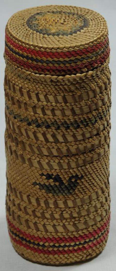 ONE EFFIGY PATTERN MAKAH WOVEN BASKET BOTTLE HAS: ORIGINAL CAP. DIFFERENT WEAVES, MOSTLY BROWN WITH SOME RED AND PURPLE, 7" H X 2 5/8"W. MOTIF: BAND OF 3 BIRD EFFIGIES. TAG IN INDIA INK: "1745". NORTHWEST COAST.