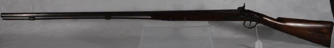 NORTHWEST TRADE GUN BRASS FURNITURE. DRAGON SIDE: PLATE. PERCUSSION. ENGRAVED HAMMER. BARREL: HALF OCTAGONAL, HALF ROUND. "E.I.G.*" PROOF MARK IN OVAL. CLEANING ROD. WRONG TRIGGER GUARD SCREW. (NOTE: BELGIAN TRADE GUN, SEE P.72 IN HANSON).