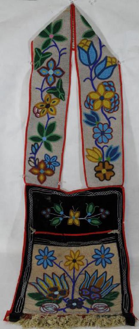 INDIAN BEADED CEREMONIAL POUCH 20" H X 14" W,: POUCH STRAPS ARE BEADED IN OVERALL FLORAL DESIGN, FABRIC HAS VERY MINOR THREAD SEPARATION, CONDITION OF BEADWORK IS SUPERIOR. FROM THE BLACKFOOT INDIAN RESERVATION AT POCATELLO, IDAHO CIRCA 1900-1915.