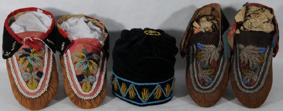 LOT OF 5 ITEMS TO INCLUDE 2 PAIRS OF BEADED: MOCCASINS AND A HAT PAIR OF BEADED IROQUOIS MOCCASINS. IROQUOIS MOCCASINS, MULTICOLORED BEADED PINK CLOTH TOES AND BLACK VELVET CUFFS, WITH LEATHER SOLES, RED BINDING IS VERY WORN, 10" LONG, ON TAG: "